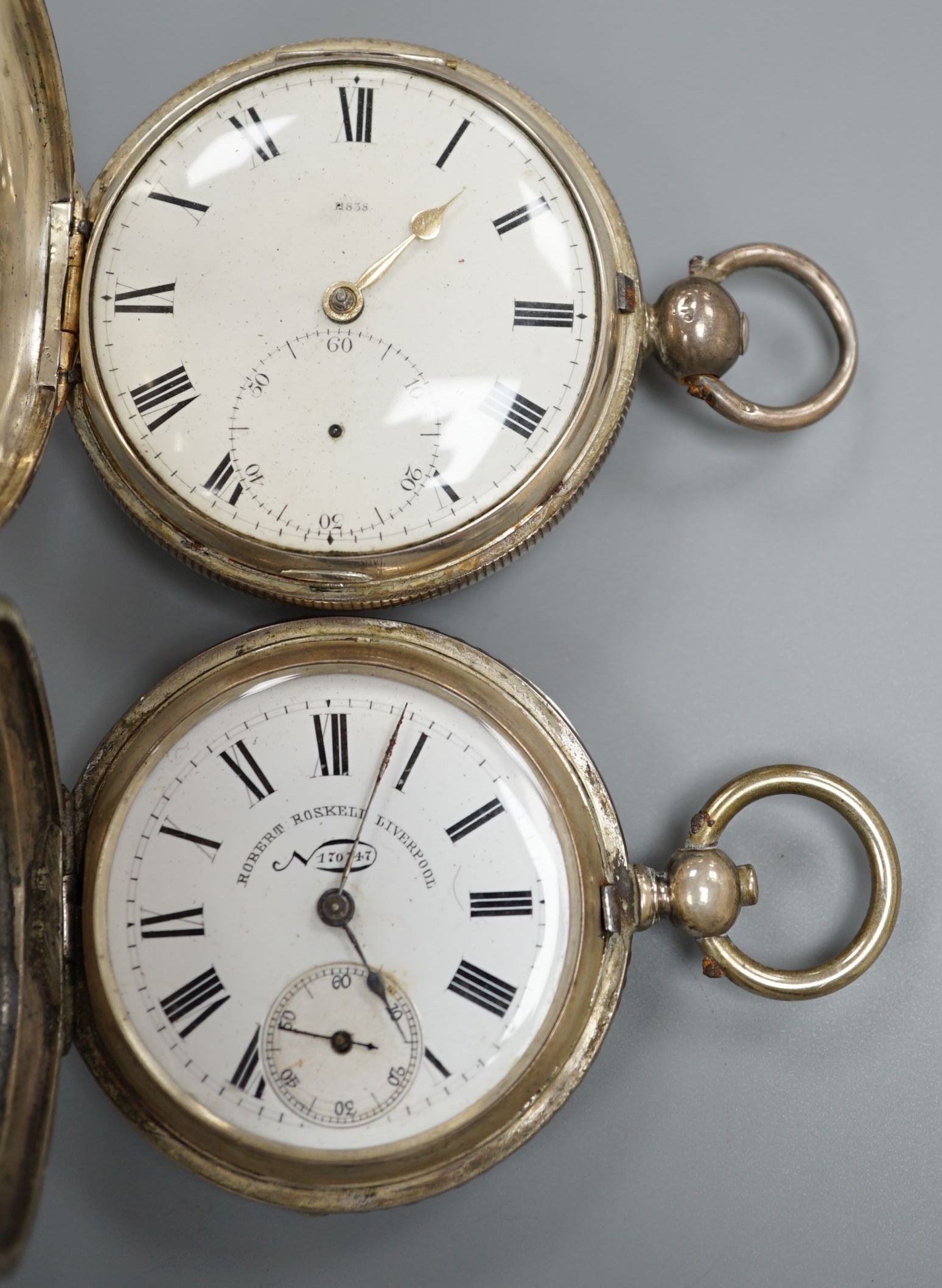 A 19th century white metal hunter pocket watch, by Robert Roskell, Liverpool, engraved with train on a bridge and one other silver hunter pocket watch.